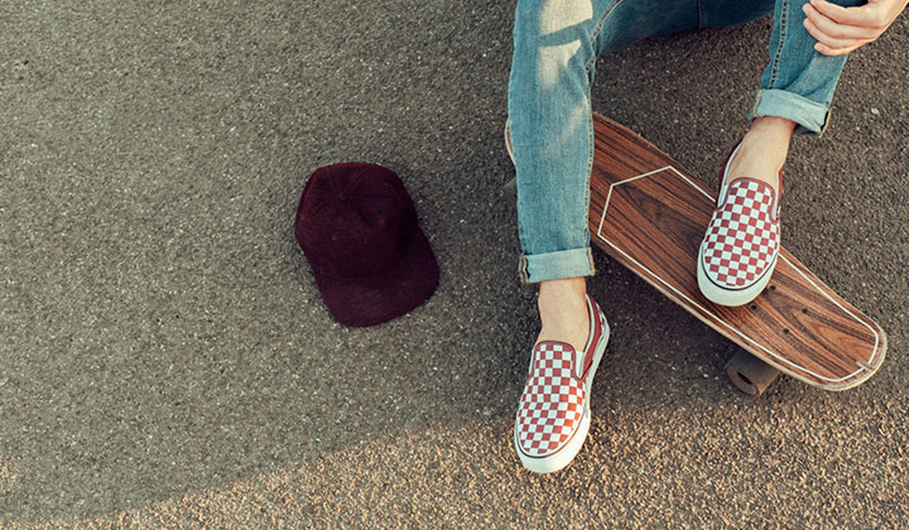 Young man wearing red checked Vans