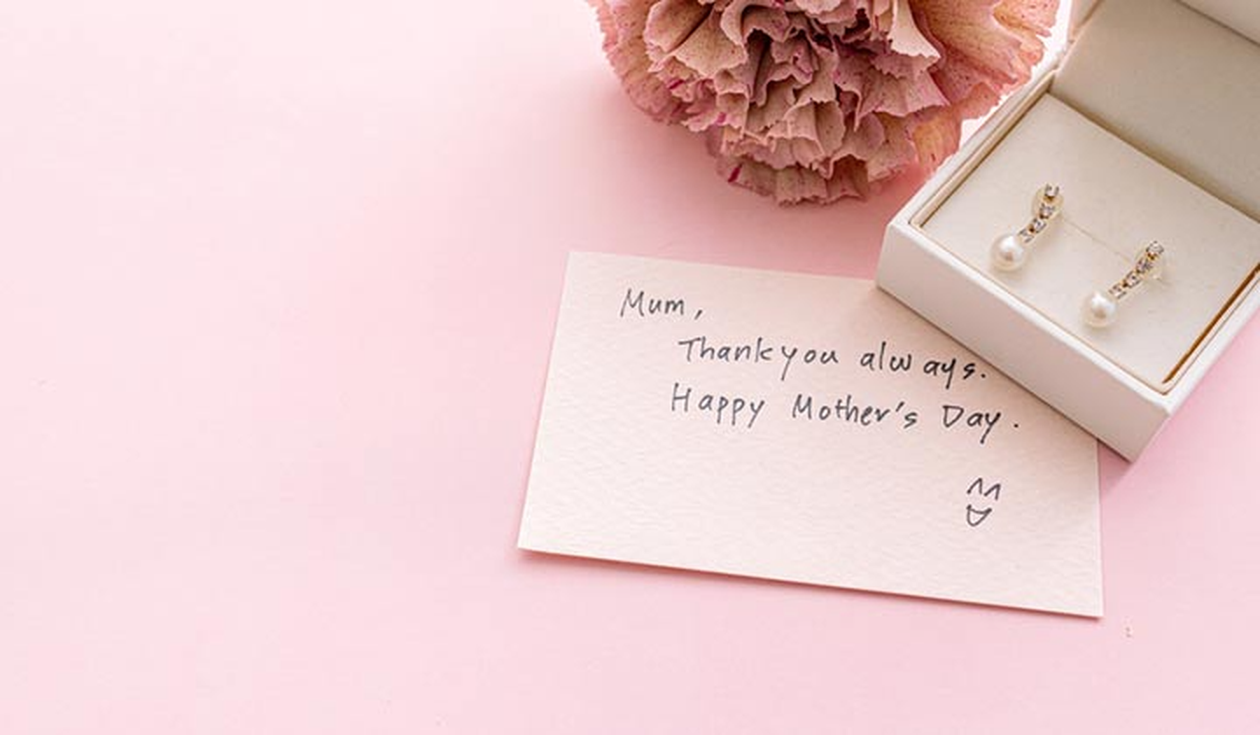 Earrings in a gift box with a note that says Happy Mother's Day