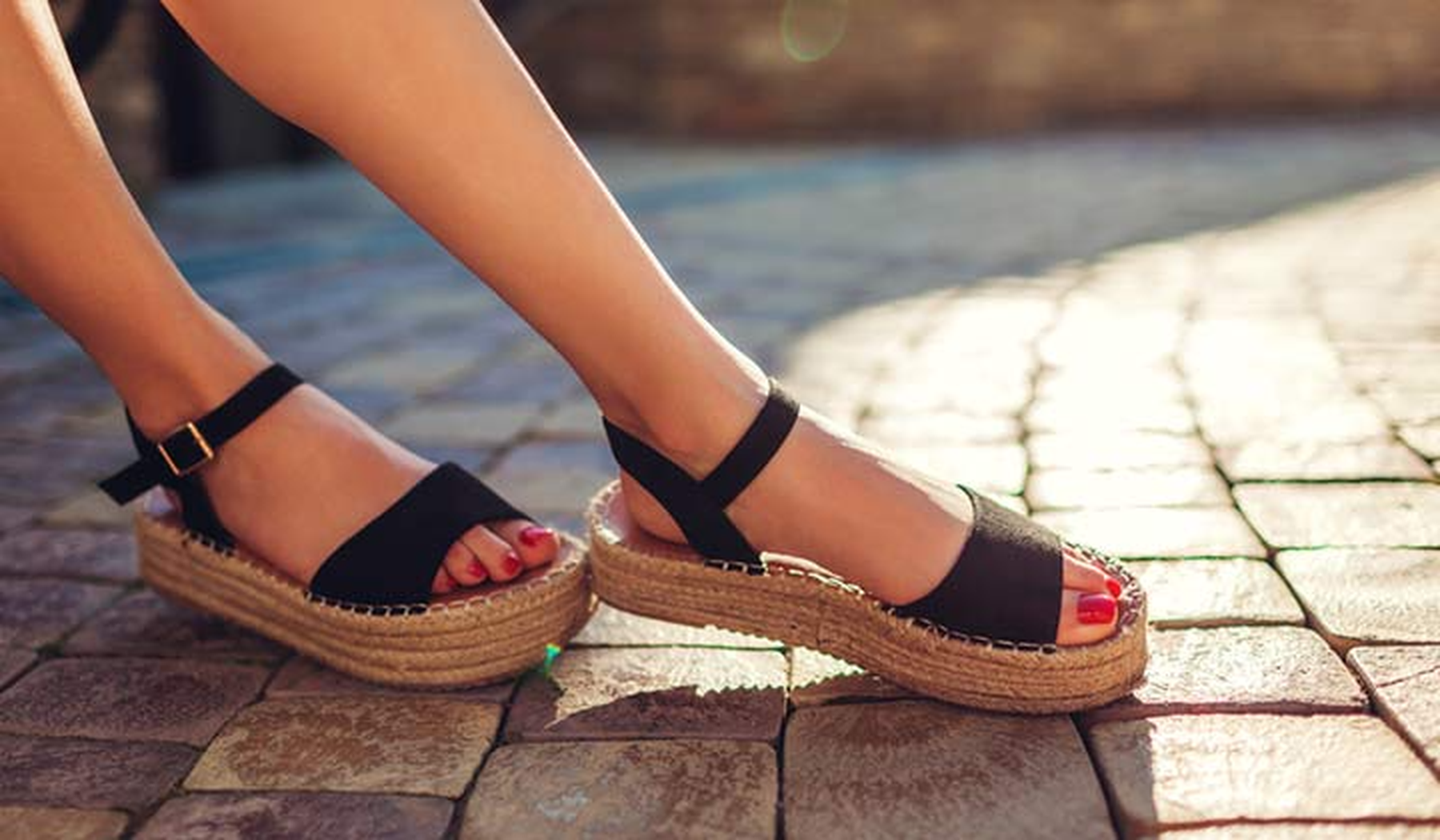 Woman wearing black platform sandals
