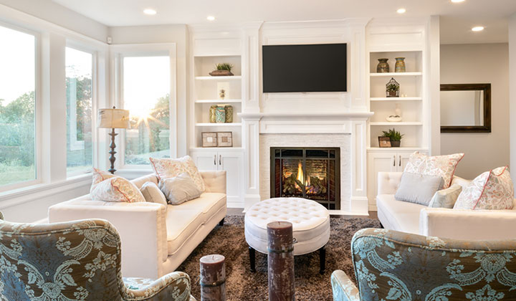Traditional living room furniture in light colors with fireplace