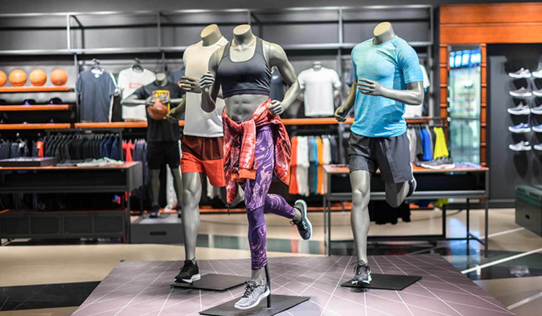 Mannequins wearing athletic clothes in store