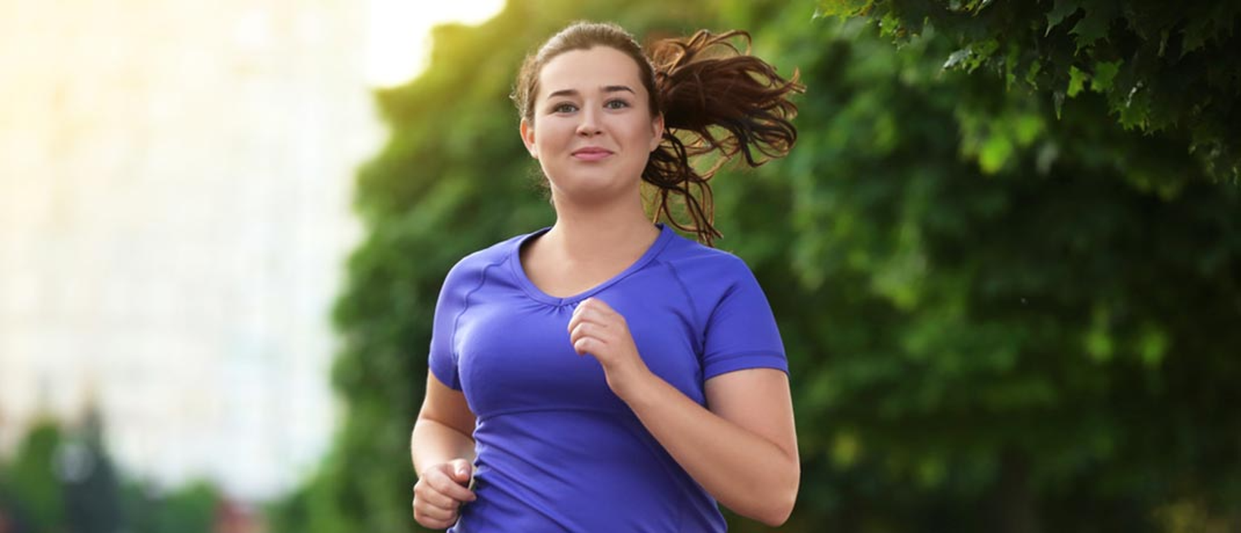 Young woman running outside
