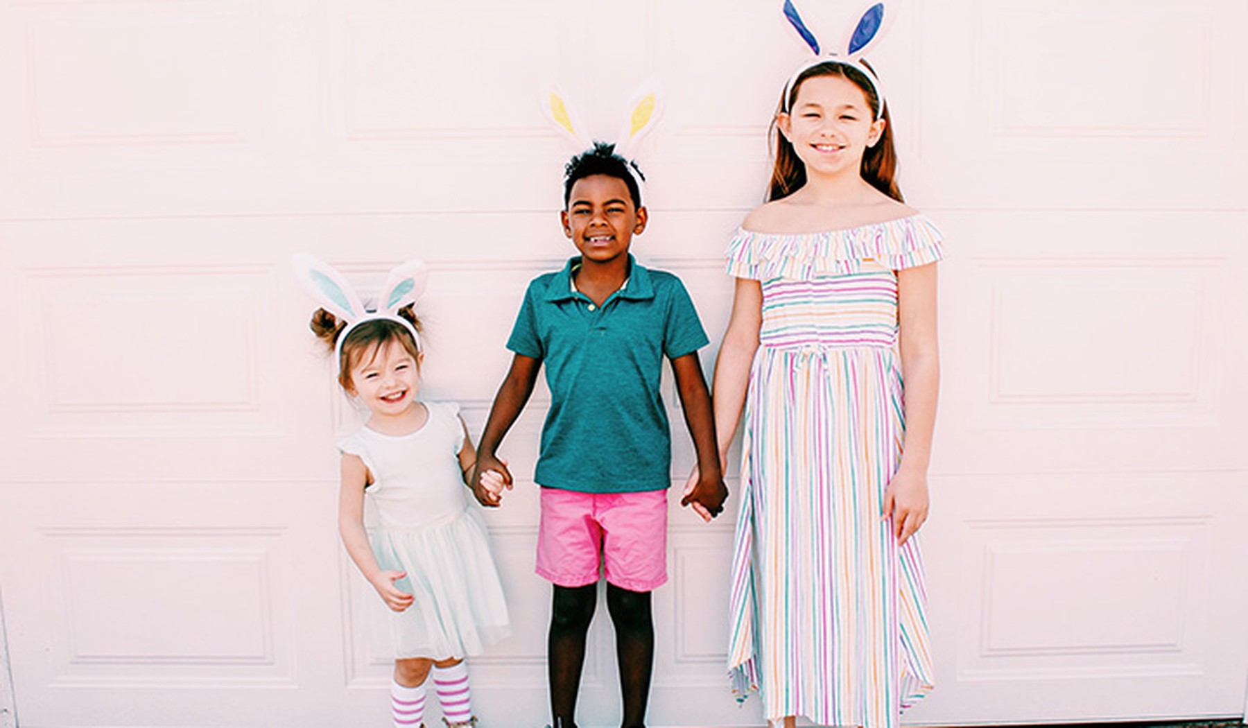 Kids Holding Hands in Easter Outfits