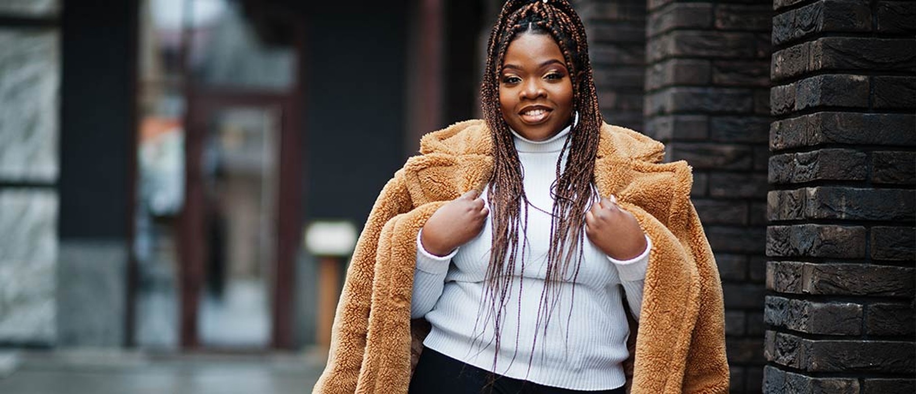 Plus size black woman in stylish outfit