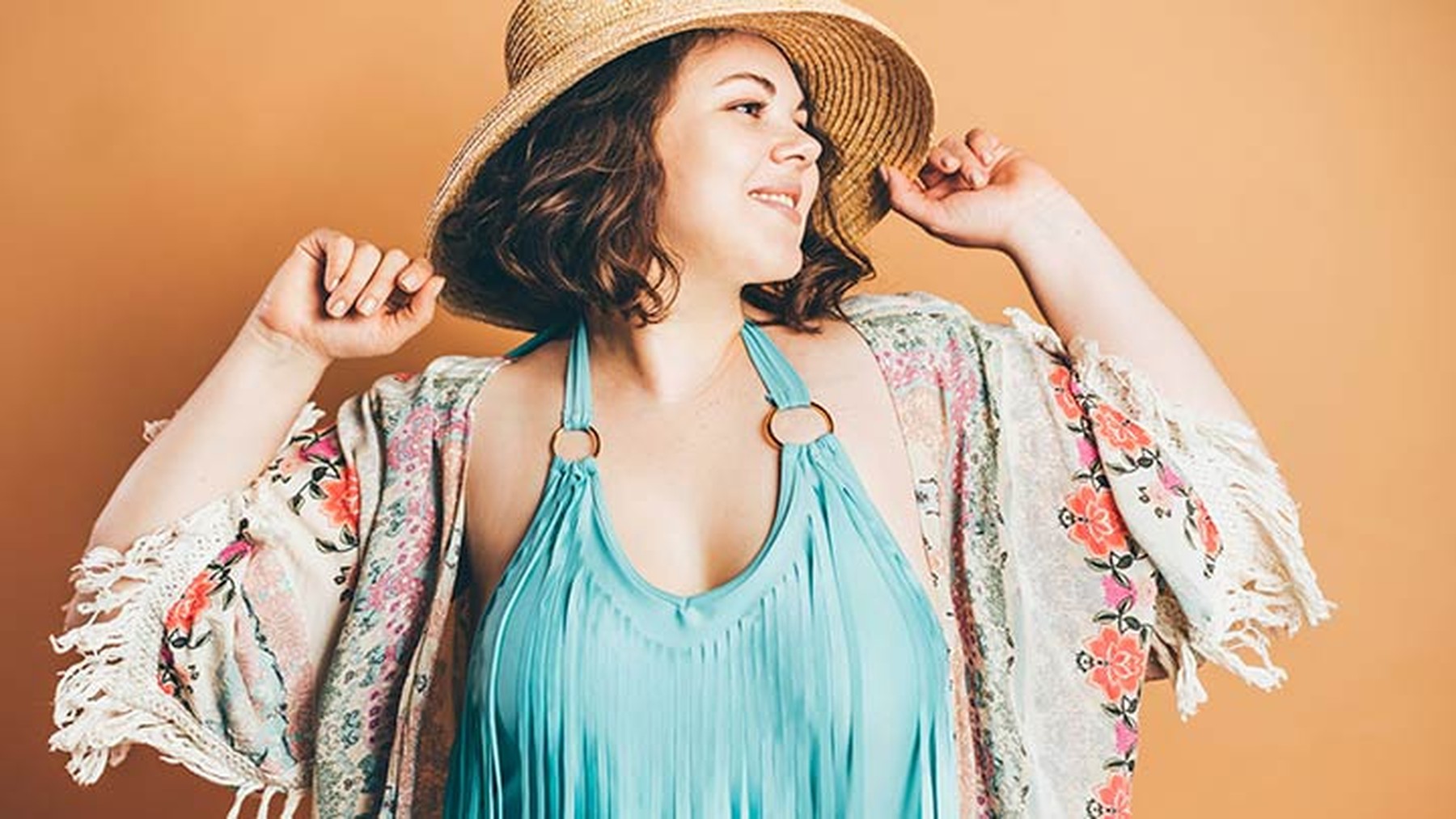 Plus size white woman in hat and spring outfit